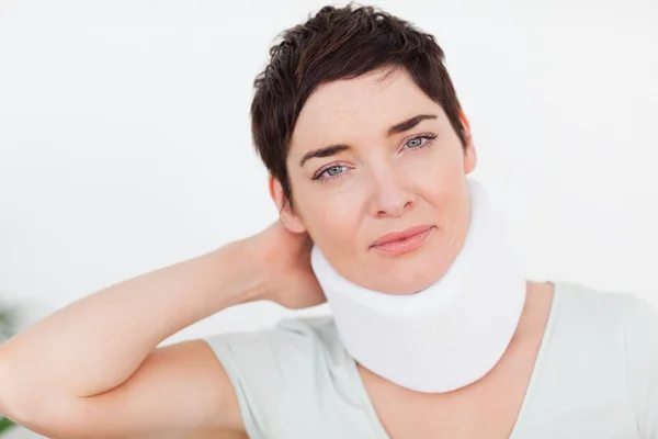 Close up of a woman with a surgical collar — Stock Photo, Image