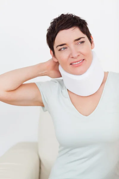 Close up of a short-haired woman with a surgical collar — Stock Photo, Image