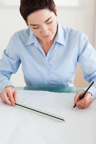 Gorgeous Woman working on an architectural plan — Stock Photo, Image