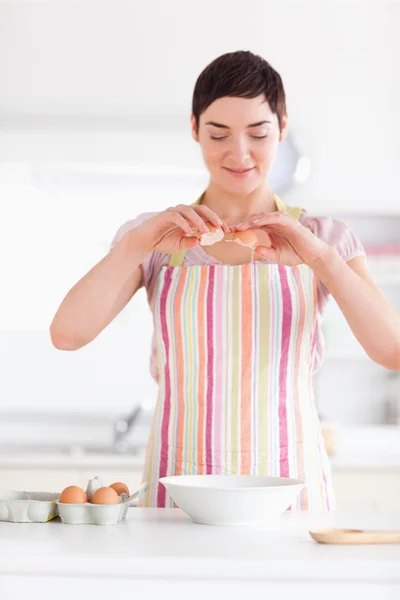 Beautiful woman preparing a cake — Stock Photo, Image