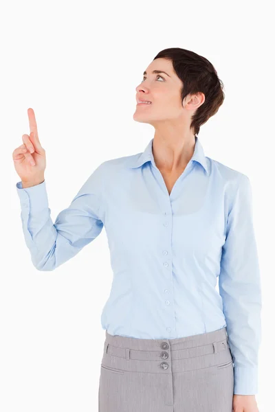 Portrait of a woman pointing at copy space — Stock Photo, Image