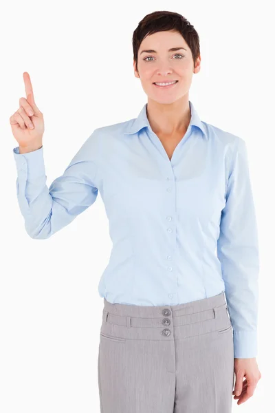 Portrait of a businesswoman pointing at copy space — Stock Photo, Image