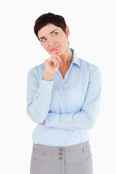 Serious businesswoman with her hand on her chin — Stock Photo, Image