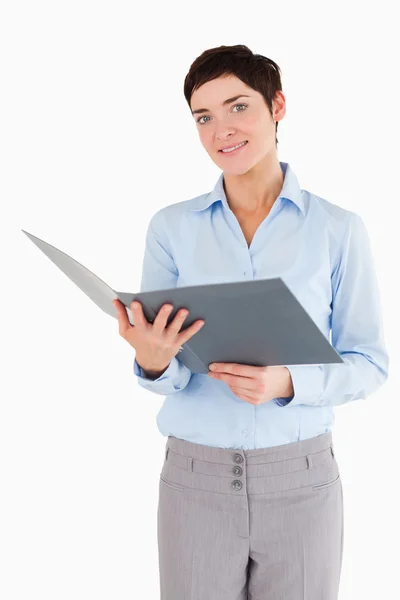 Portrait of a businesswoman holding a binder — Stock Photo, Image