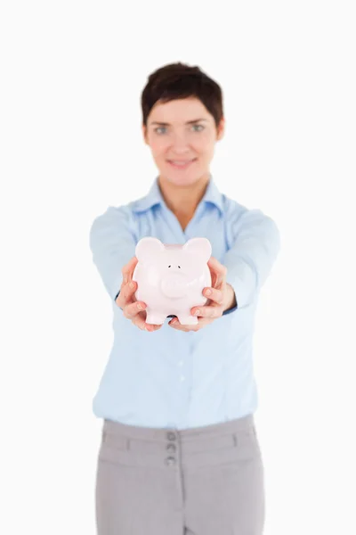 Businesswoman holding a piggy bank — Stock Photo, Image