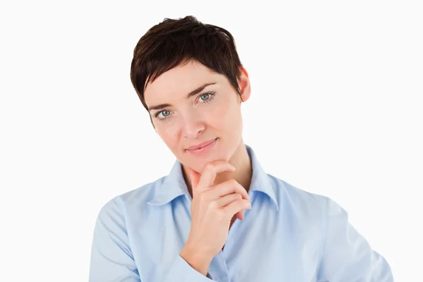 Närbild på en affärskvinna med sin hand på hennes haka — Stockfoto