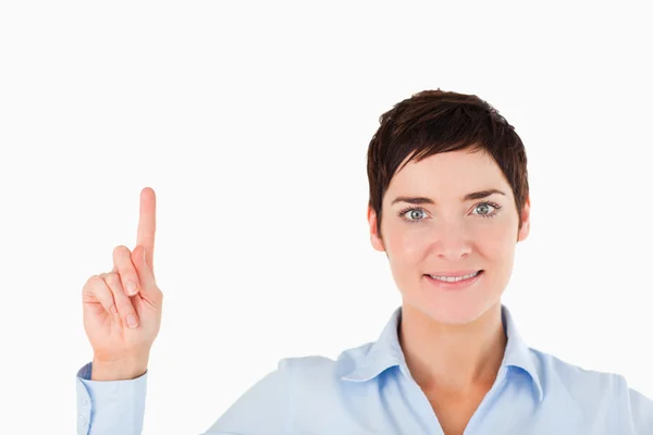 Close up of a woman pointing at copy space — Stock Photo, Image