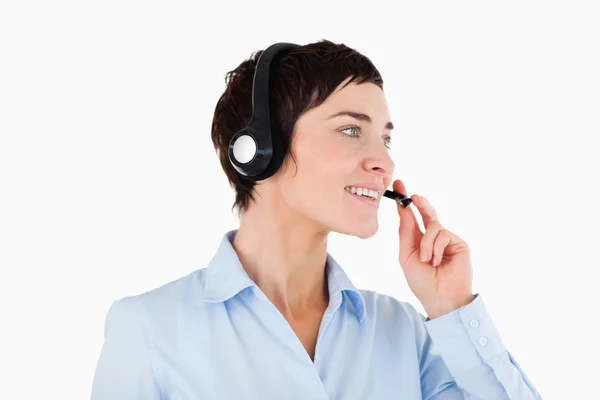 Primer plano de una mujer de negocios usando un auricular —  Fotos de Stock