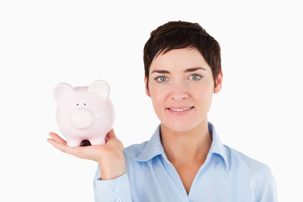 Close up of a female worker holding a piggy bank — Stock Photo, Image