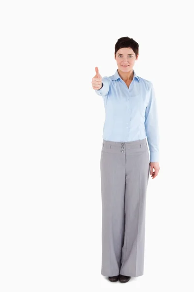 Pracownik biurowy, stojąc z jej kciuk — Zdjęcie stockowe