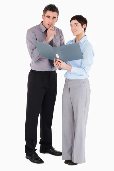 Office workers holding a binder — Stock Photo, Image
