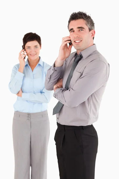 Portrait of coworkers making a phone call — Stock Photo, Image
