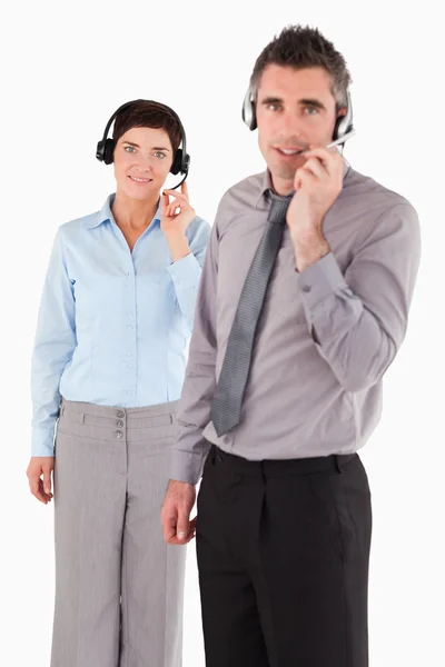 Portrait of coworkers using headsets — Stock Photo, Image