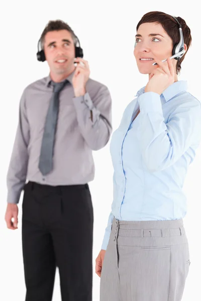Portrait of colleagues using headsets — Stock Photo, Image
