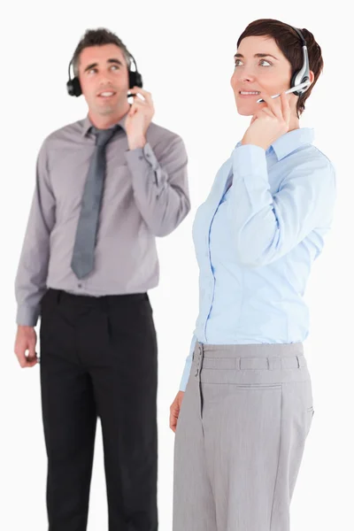 Portrait of managers using headsets — Stock Photo, Image