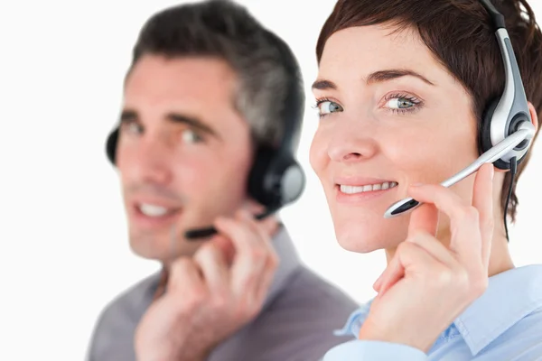 Close up of switchboard operator speaking through headsets — Stock Photo, Image