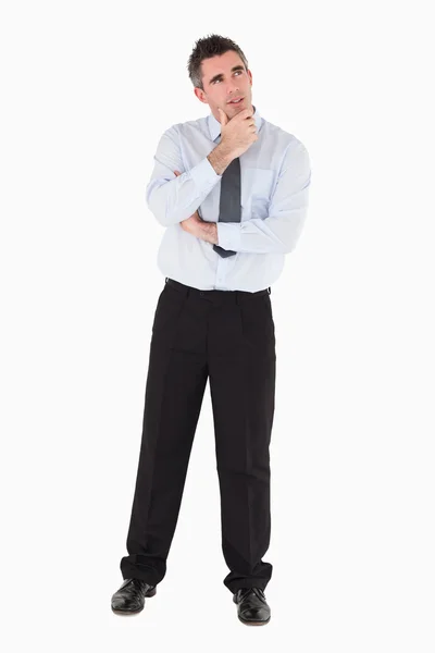 Thoughtful businessman with his hand on his chin — Stock Photo, Image