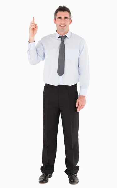 Businessman pointing at copy space — Stock Photo, Image