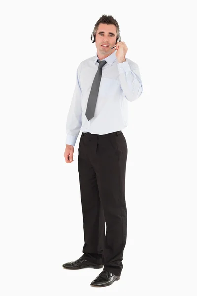Secretário posando com um fone de ouvido — Fotografia de Stock