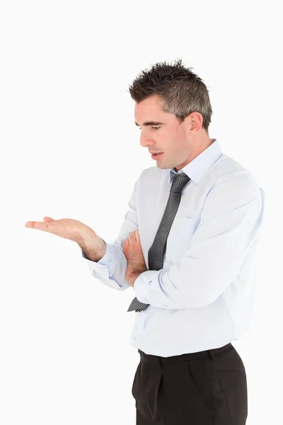 Portrait of a businessman looking a copy space on his hand — Stock Photo, Image