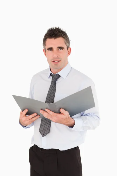 Portrait of a man holding a binder — Stock Photo, Image