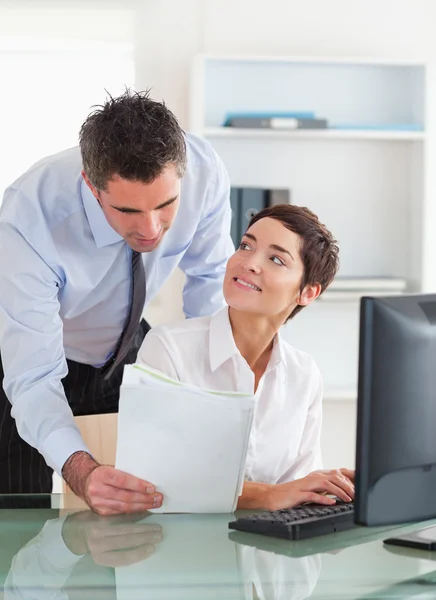 Portrait of a businessman showing a document to his colleague — Stock Photo, Image