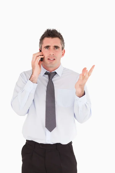 Portret van een teleurstellend man waardoor een telefoongesprek — Stockfoto