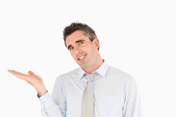 Smiling businessman showing a copy space — Stock Photo, Image