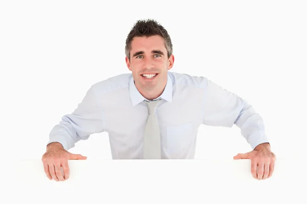 Businessman standing behind a copy space — Stock Photo, Image