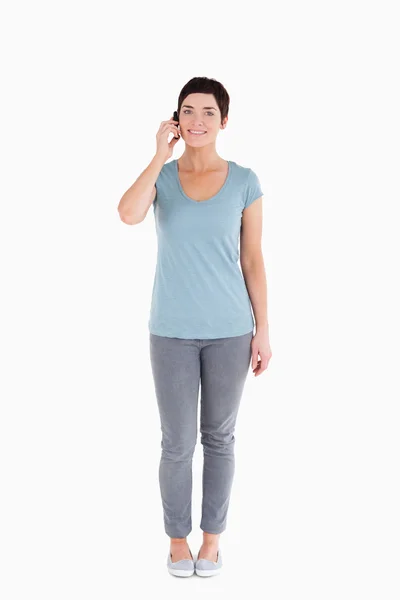 Serene woman answering the phone — Stock Photo, Image