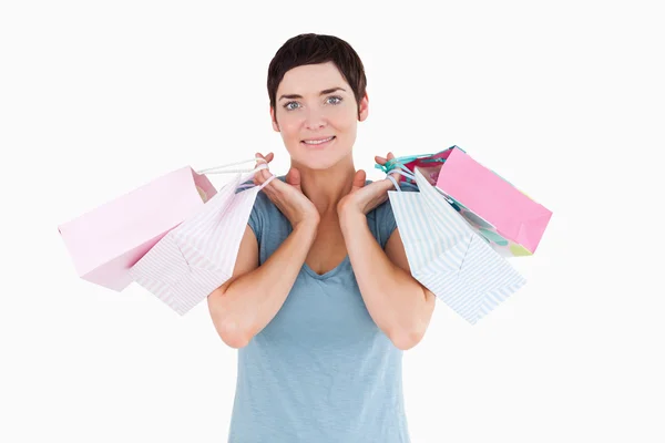 Roztomilá žena hospodářství nákupní tašky — Stock fotografie