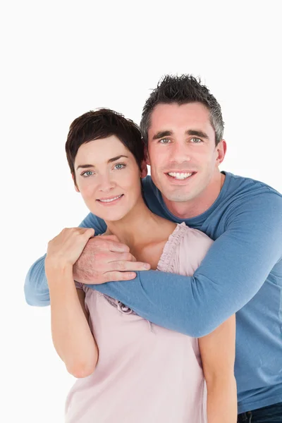 Portrait of a man embracing his wife — Stock Photo, Image