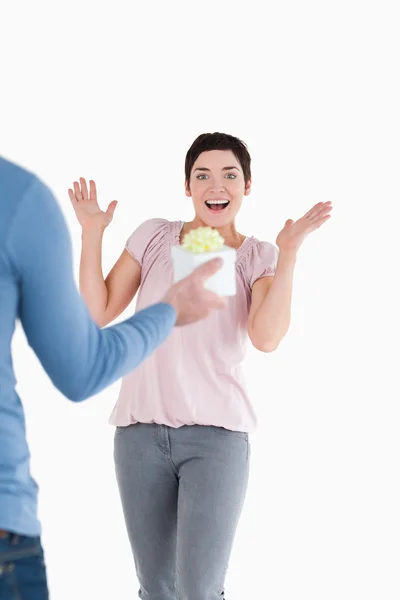 Woman surprised by her husband with a present — Stock Photo, Image