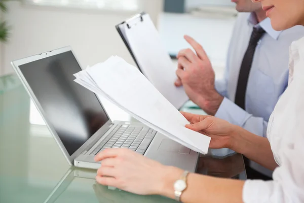 Managers comparing a blueprint document to an electronic one — Stock Photo, Image