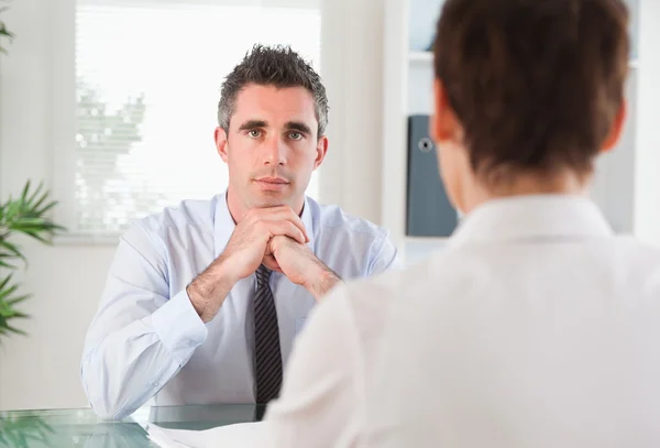 Handsome manager interviewing an applicant — Stock Photo, Image