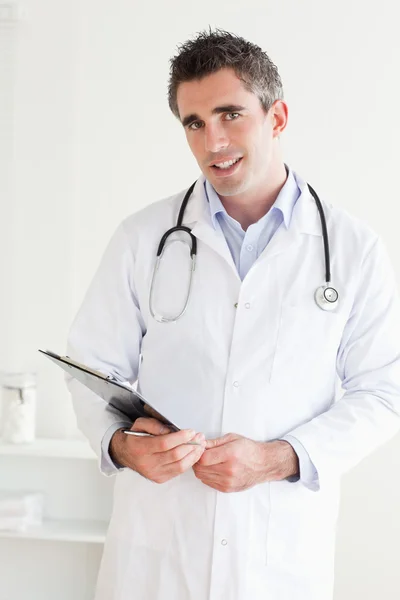 Smiling Doctor looking into the camera — Stock Photo, Image