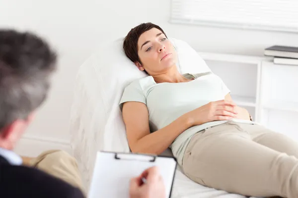 Male Doctor talking to a female patient — Stock Photo, Image