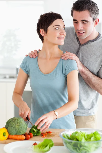 Husband peeking over his wife's shoulder — Stock Photo, Image