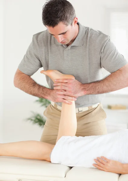 Woman's leg being massaged — Stock Photo, Image