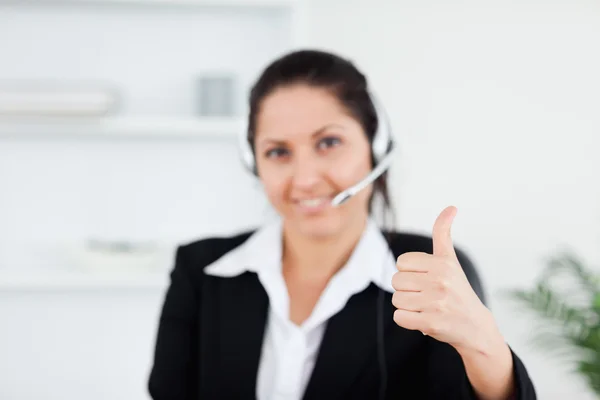 Beautiful businesswoman with thumb up — Stock Photo, Image
