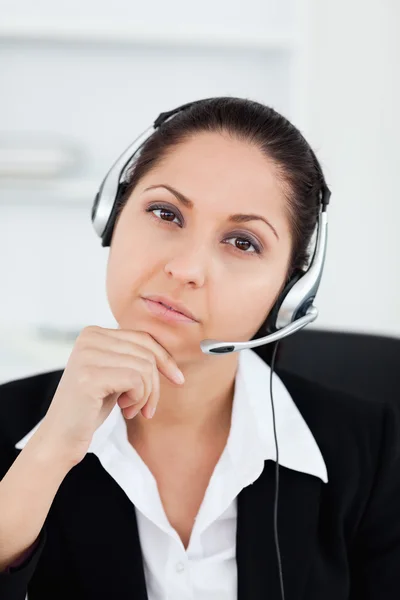Thoughtful operator looking into camera — Stock Photo, Image