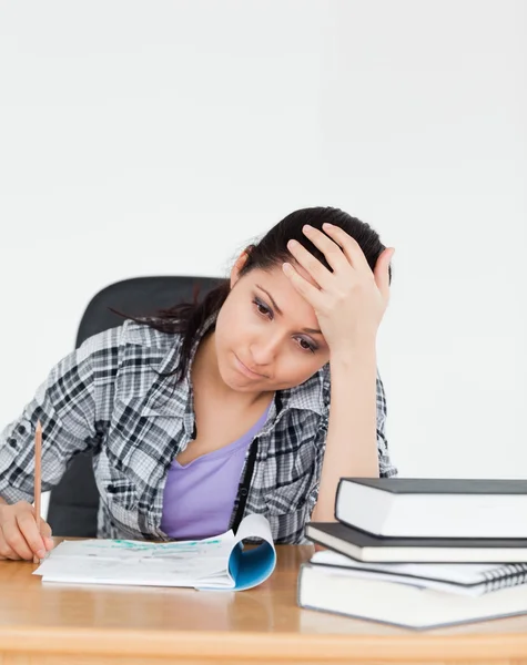 Frustrated young student with homework — Stock Photo, Image