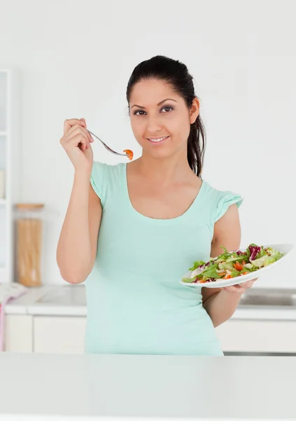 Young adult eating salad — Stock Photo, Image