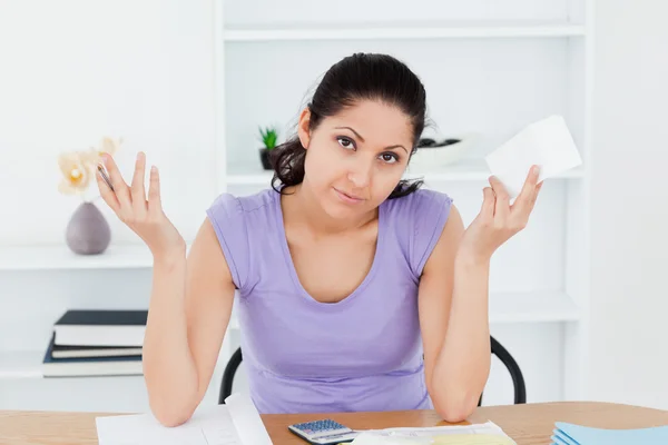 Unenthusiastic young woman accounting — Stock Photo, Image