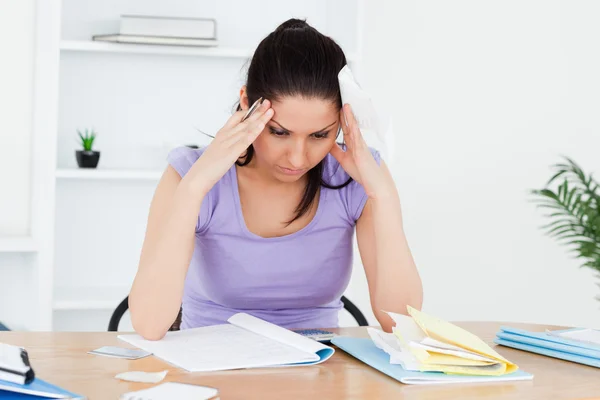 Stressed young woman accounting — Stock Photo, Image