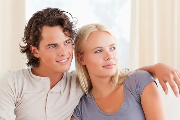 Young couple sitting on a sofa Stock Image