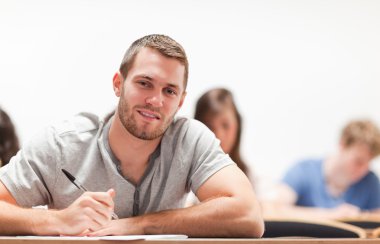 Smiling student sitting clipart