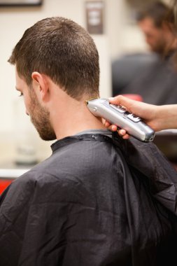 Portrait of man having a haircut clipart
