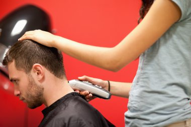 Male student having a haircut clipart