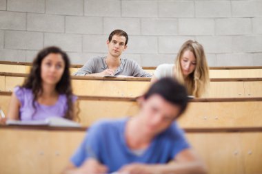 Young students during a lecture clipart